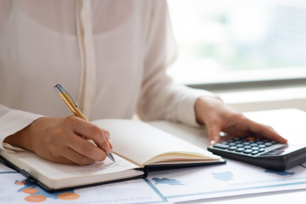 business-expert-analyzing-reports-counting-expenses 1 - 9M Investments Maximizing Tax Planning Strategies