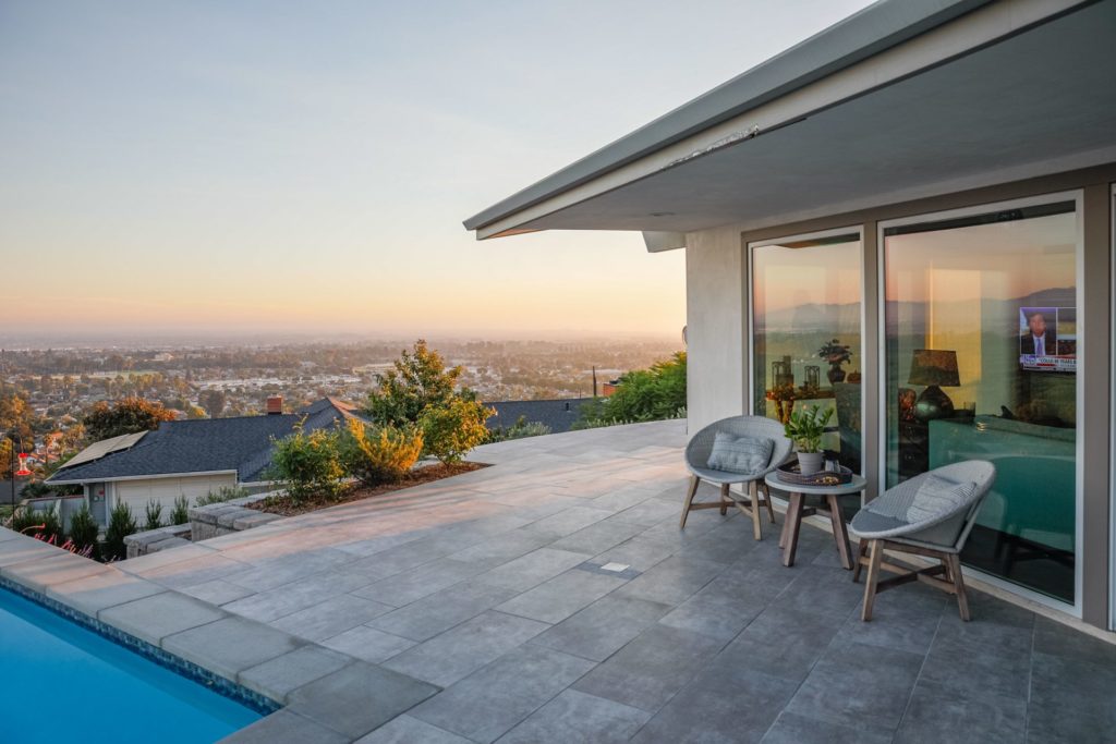 Modern paver patio with infinity pool in Ventura County near Thousand Oaks outdoor living design