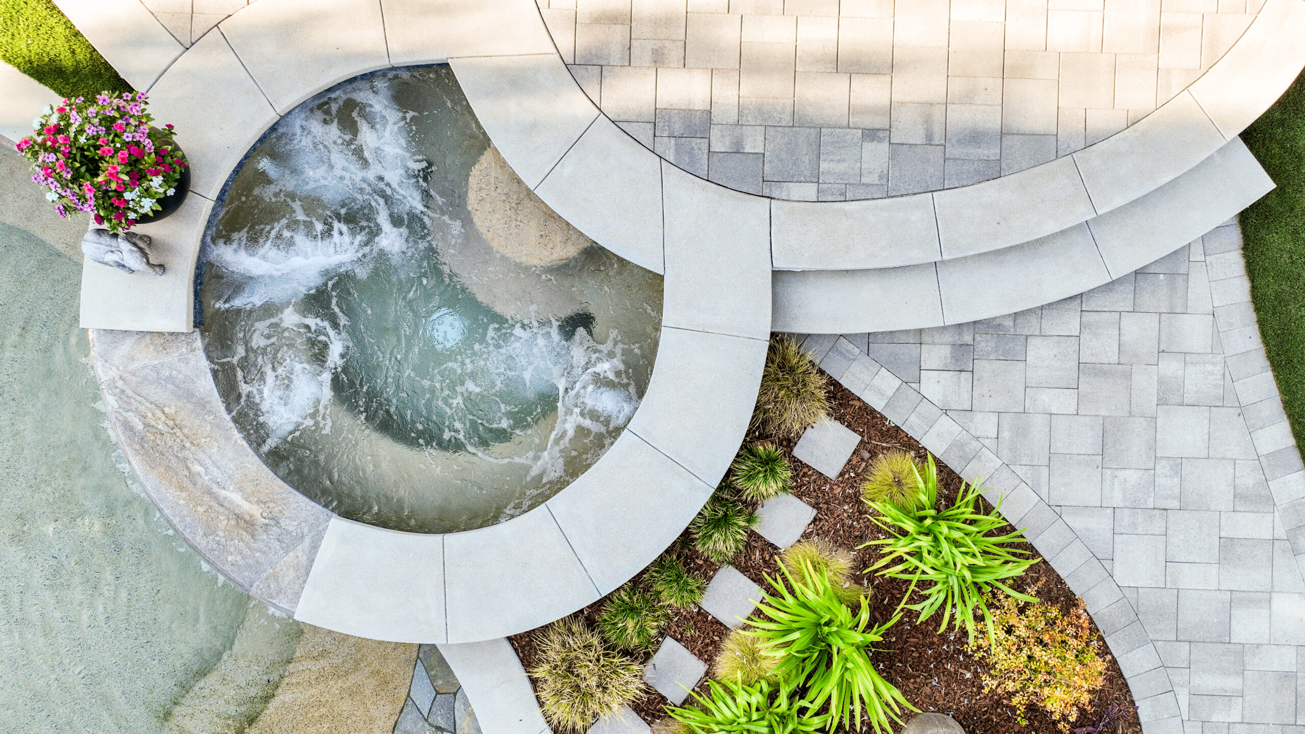 Custom Paver Pool Deck & Raised Spa | Camarillo, CA Custom concrete paver pool deck and raised spa with curved masonry detailing in Camarillo, California