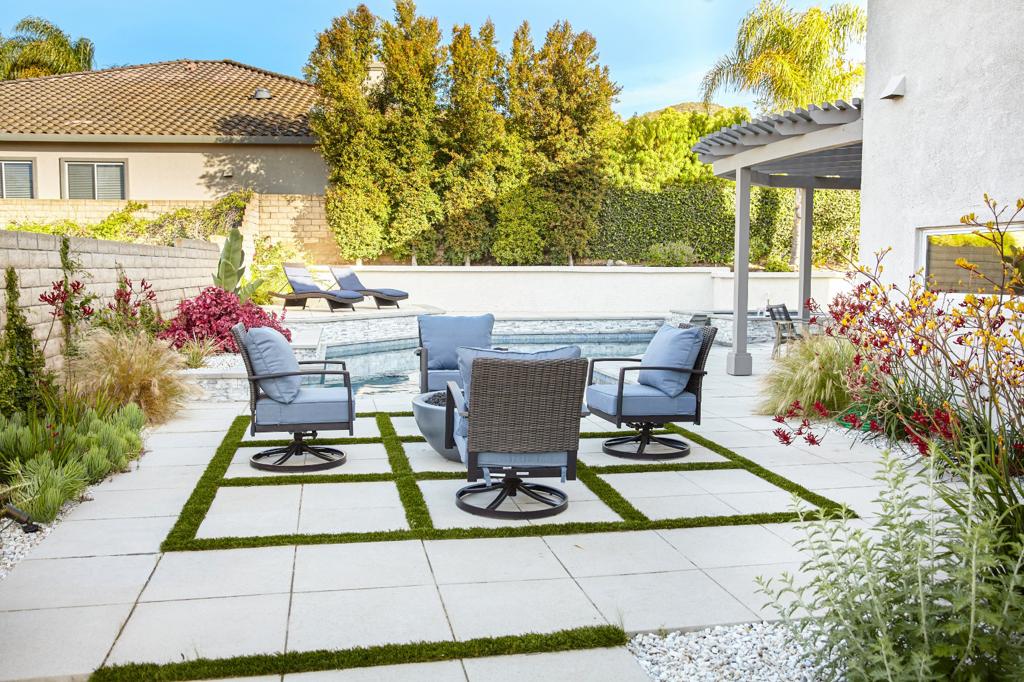5 Modern Pavers: Elevating Outdoor Living with Style 1 Modern concrete paver patio with large square slabs and grass joints in a Newbury Park backyard, Thousand Oaks