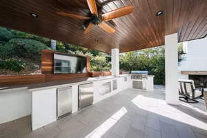 5 Modern Pavers: Elevating Outdoor Living with Style 2 Rectangular concrete pavers patio with outdoor kitchen in Thousand Oaks backyard design