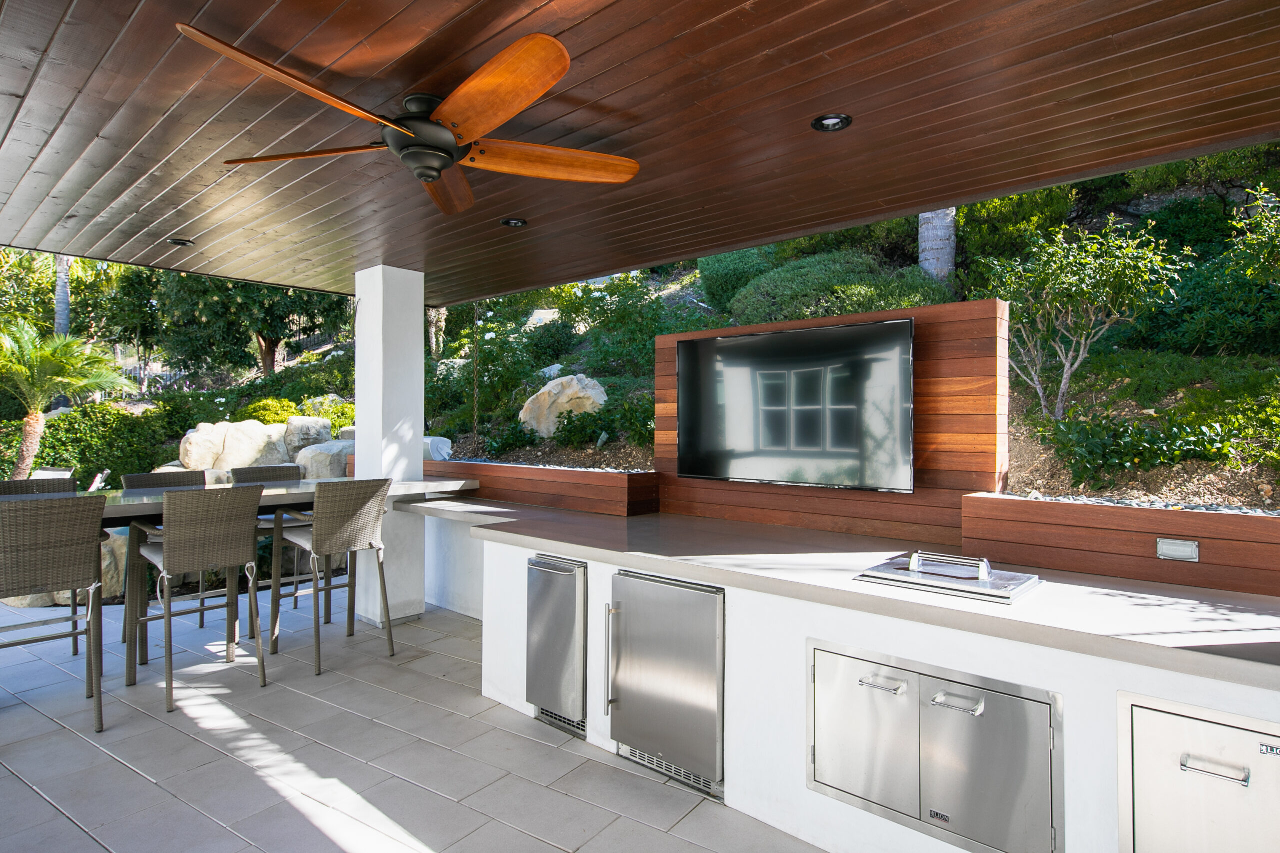 Custom Outdoor Kitchen & Cabana in Thousand Oaks Custom outdoor kitchen under a covered cabana with dining area and outdoor entertainment space in Thousand Oaks, California.