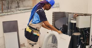 AC Repair 2 Repairman-working-on-air-conditioner