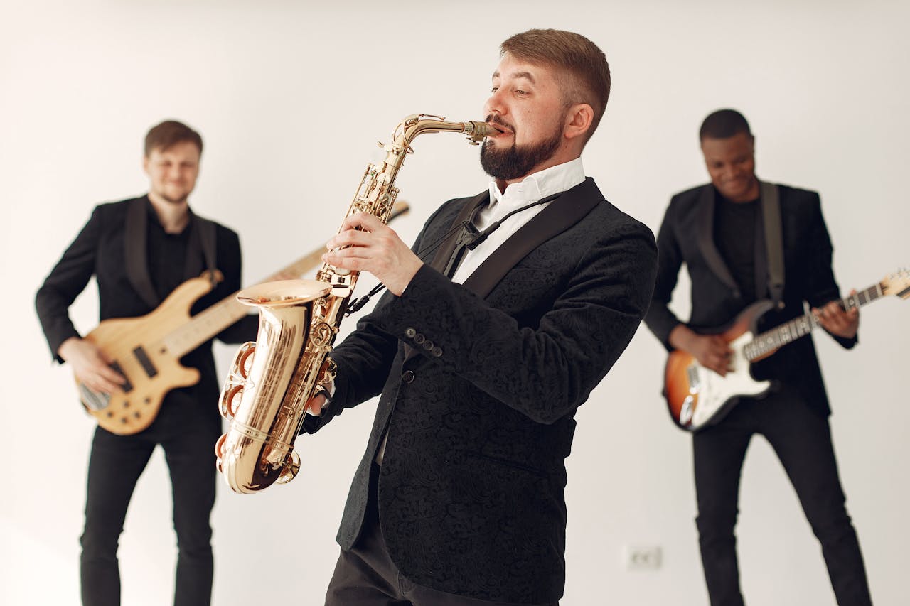 mission-img A lively jazz band playing different instruments on stage, creating a vibrant musical atmosphere.