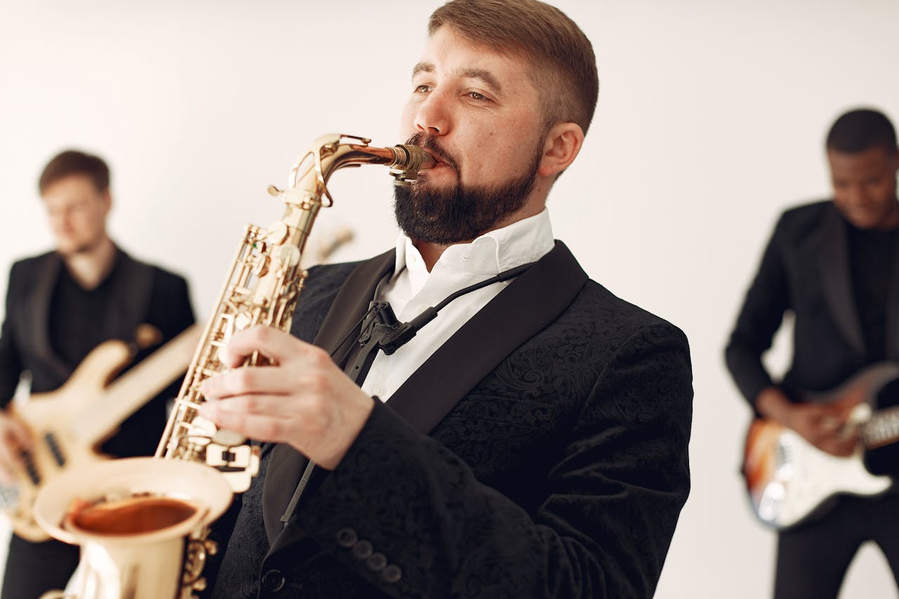 process-img Talented jazz band performing with saxophonist and guitarists in an indoor setting.