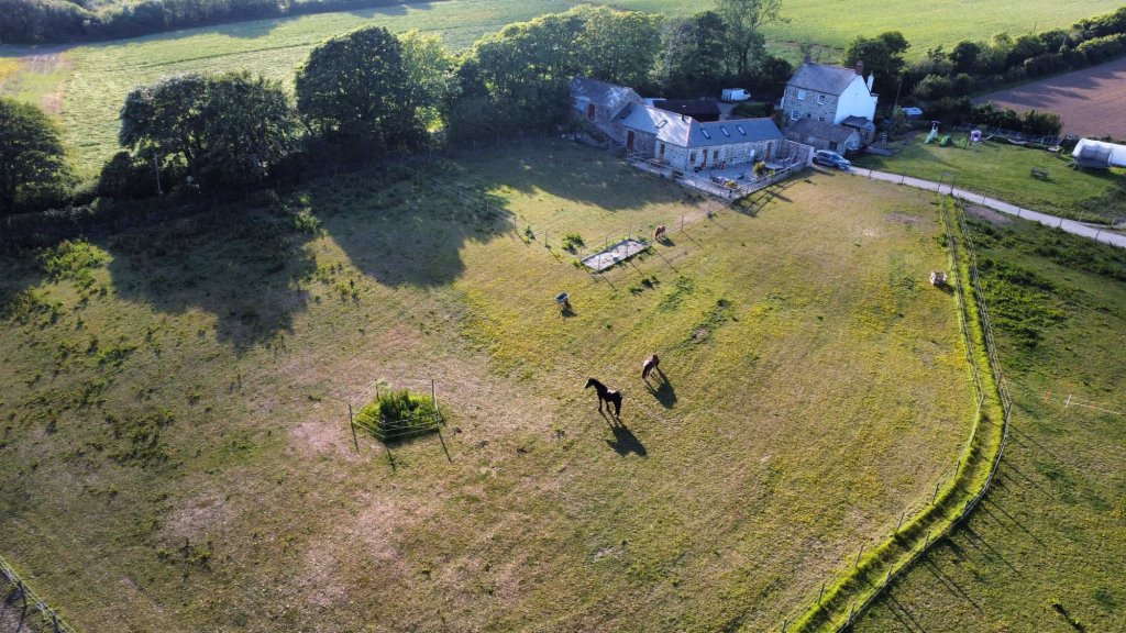 Noonvares Farm from the air, showing the house, the stables and the grazing