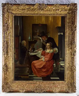 Un tableau encadré représente une scène d'intérieur avec trois personnages. Un homme coiffé d'un chapeau noir se penche sur une femme assise en robe rouge, incarnant l'expression « ce que j'achète ». Un autre homme est assis à l'arrière-plan, tandis que la pièce arbore un sol à carreaux et un mobilier raffiné.