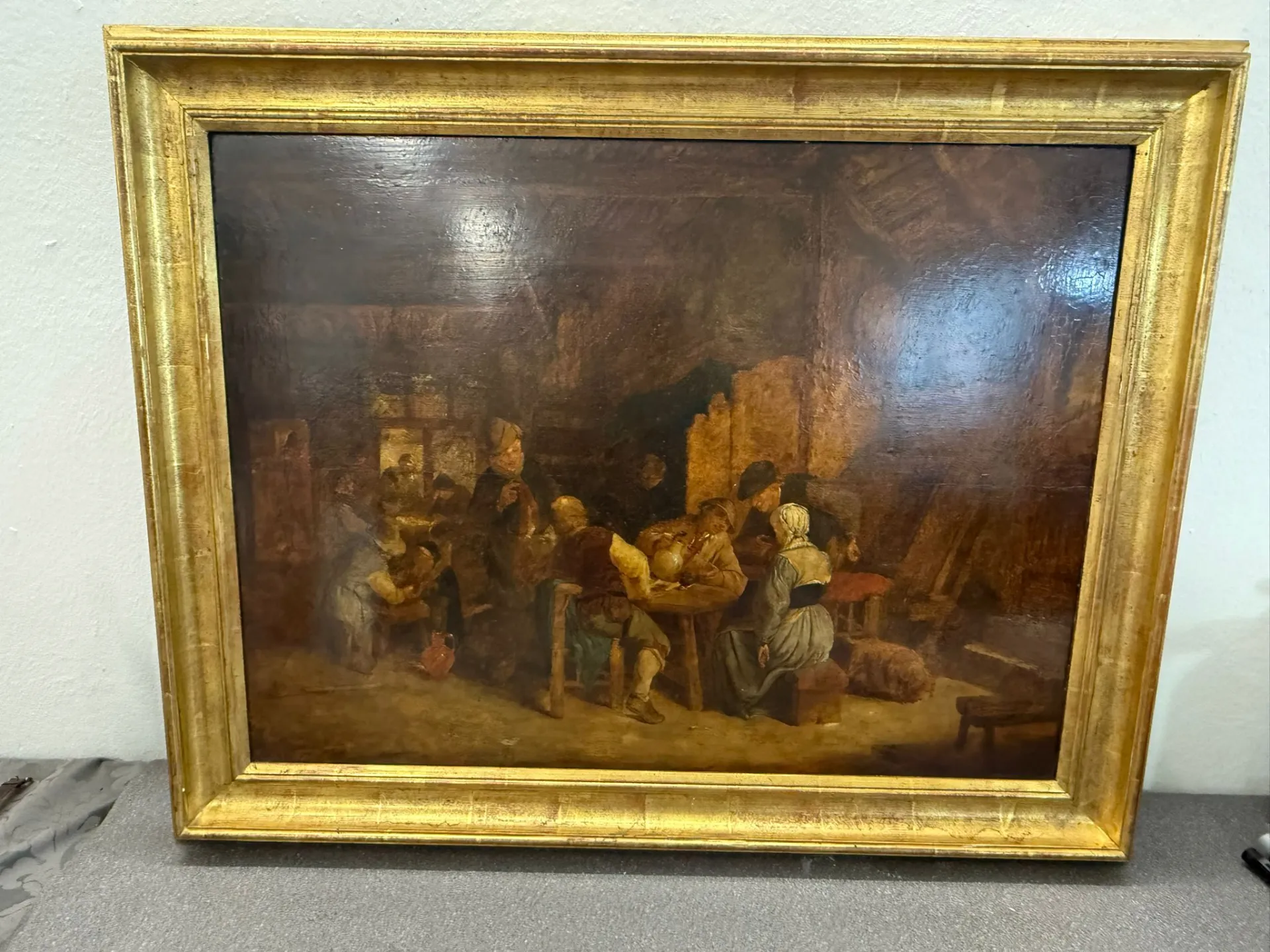 Peinture ancienne représentant une scène de taverne.
