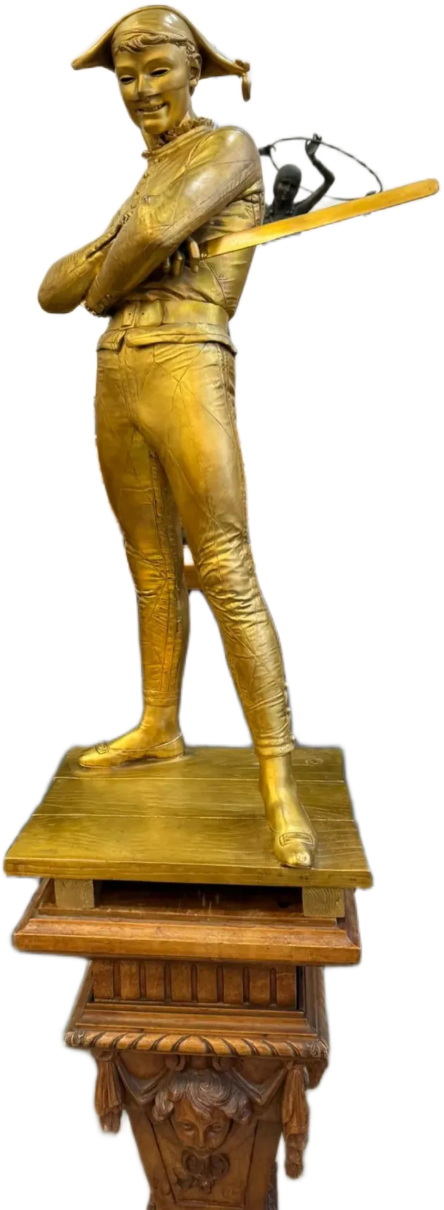 Statue dorée d’un joueur de baseball au bâton