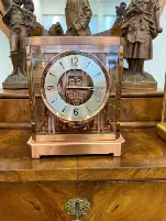 Horloge ancienne en verre et métal doré