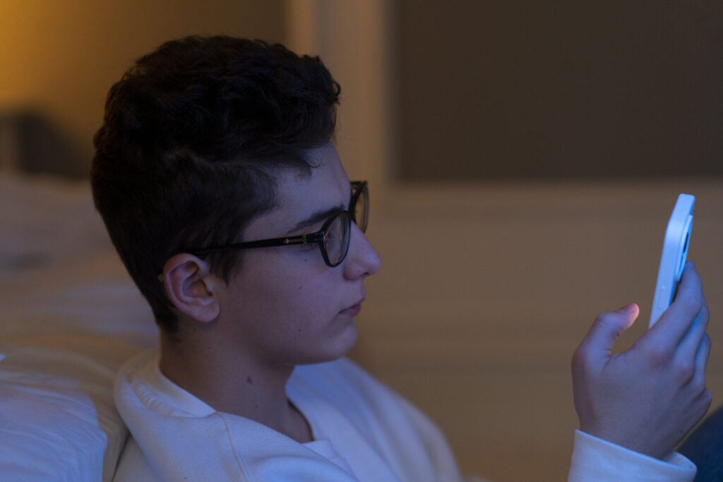 are ai companions safe for teens - A vibrant illustration of a friendly AI companion engaging with a teen, exploring if AI co
