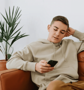 PexelTeenCellPhone therapeutic boarding schools for troubled teens - A teenager holding a smartphone, suggesting the importance of communication