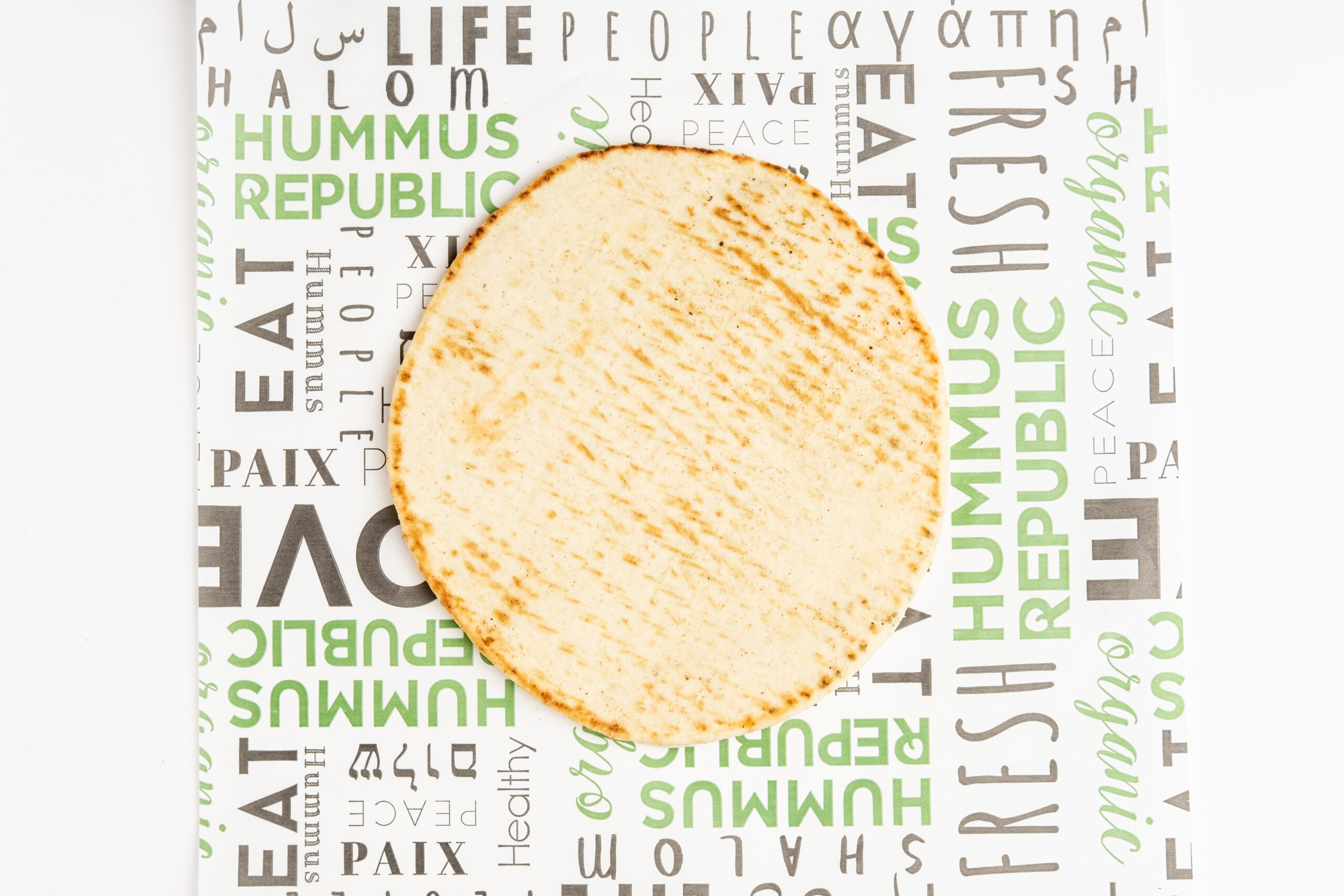 How a Centralized Supply Chain Actually Changes the Daily Reality of Running a Kitchen Freshly prepared hummus bowls and Mediterranean ingredients on a Hummus Republic counter, illustrating what a restaurant franchise with central supply chain delivers every morning