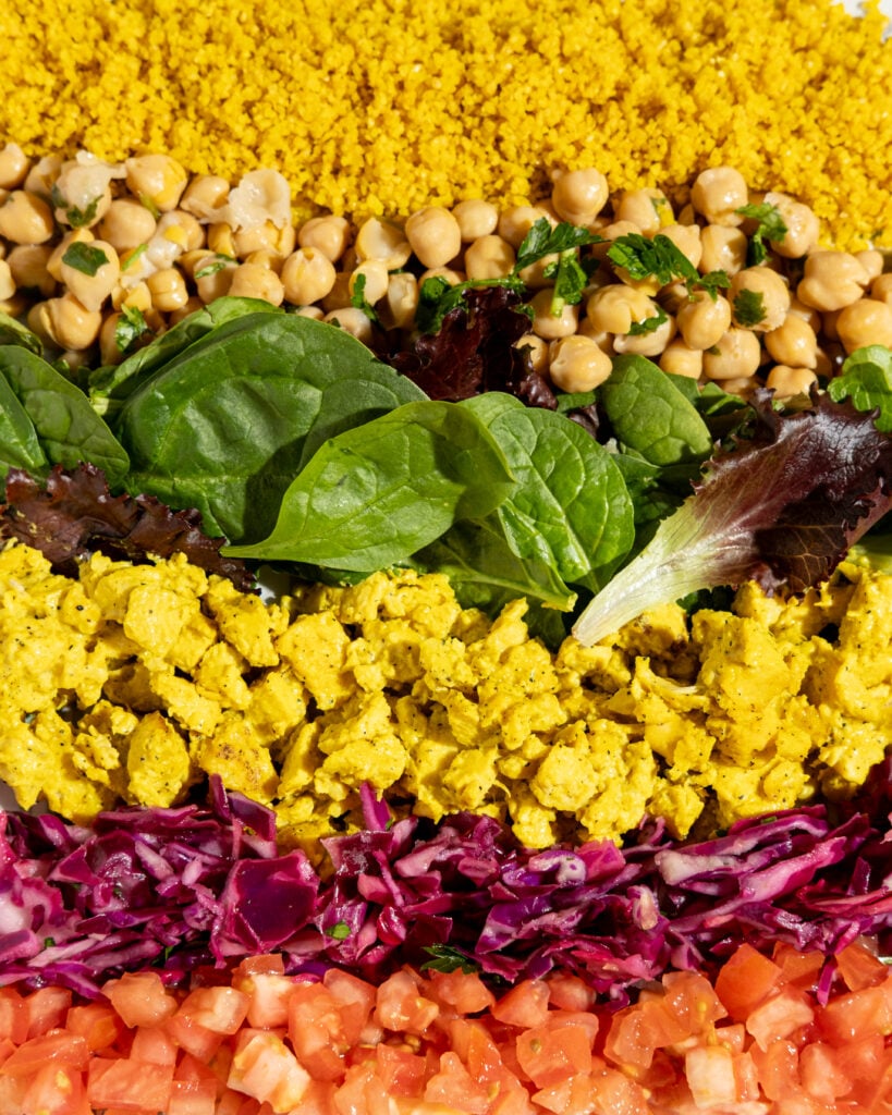 Why a Short, Intentional Menu Builds More Customer Trust Than a Long One A bright how to negotiate a franchise territory consultation moment inside a Mediterranean fast casual restaurant, with fresh hummus and mezze displayed on a polished counter under warm afternoon light