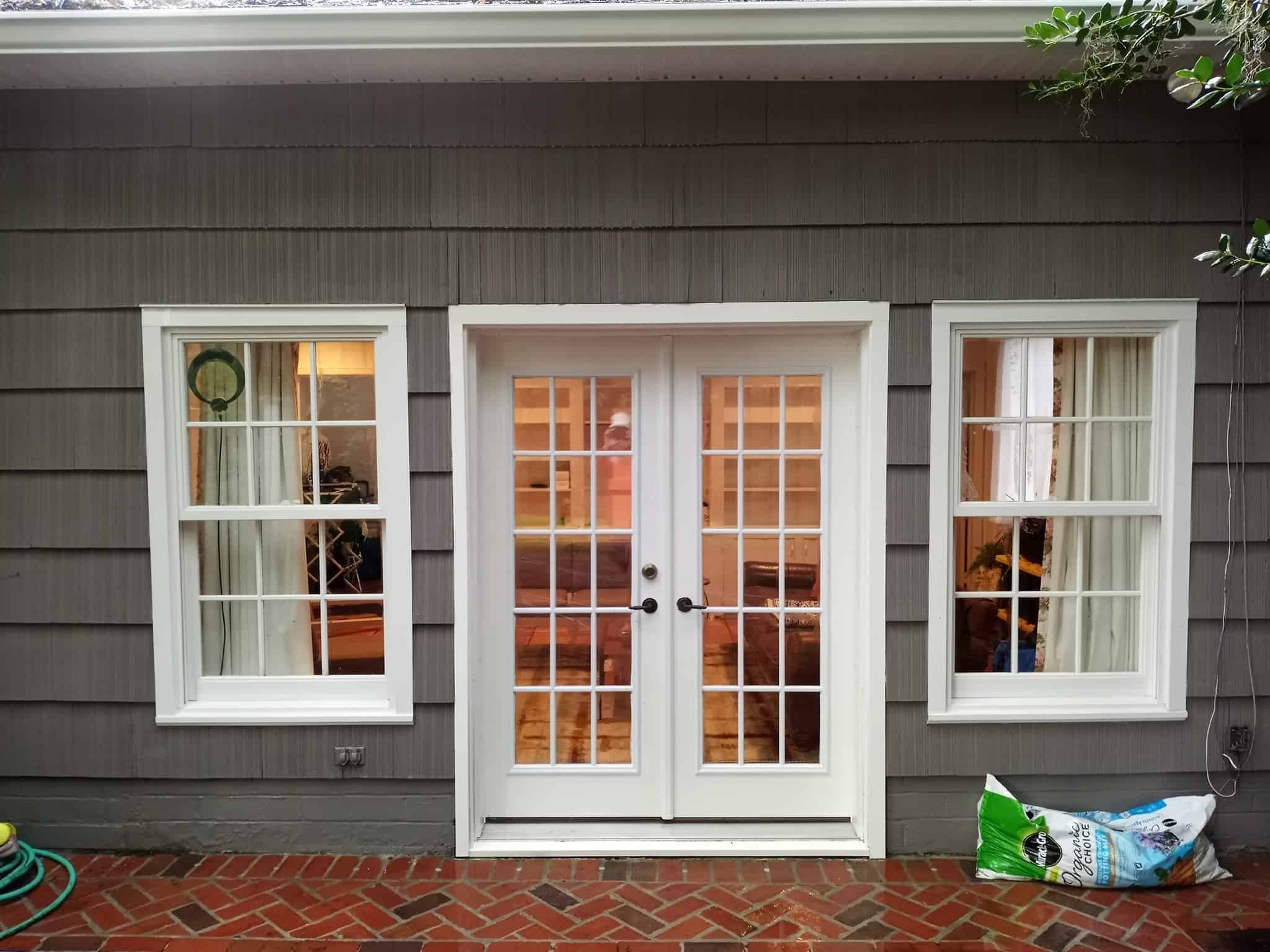 soft wash house cleaning Jacksonville - A residential house with a clean, soft-washed exterior in Jacksonville, showcasing th