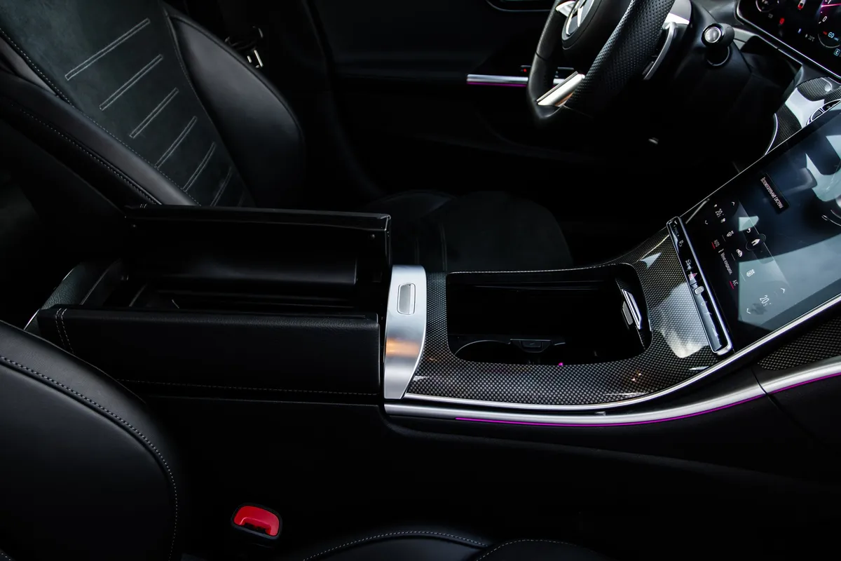 An opened armrest in a luxury car, highlighting comfort for special occasions and black car service.