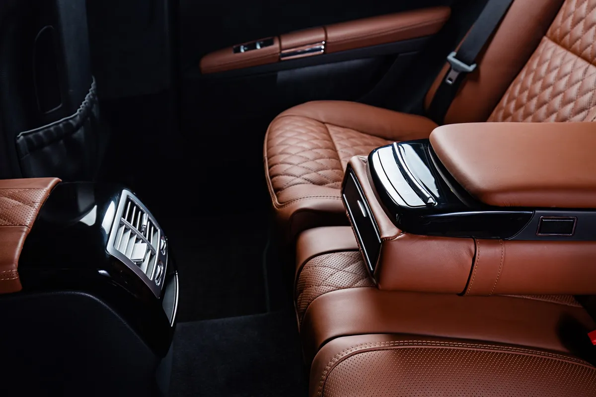 Luxurious brown and black car interior, ideal for a comfortable business trip.