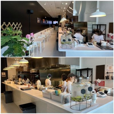 Modern urban Vietnamese restaurant interior with sleek wooden furniture, ambient lighting, and minimalist decor.