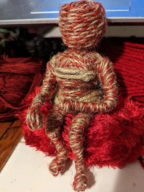 A side view of "Silma Who Sits with Her Anger" in it's rough, baker's twine stage.