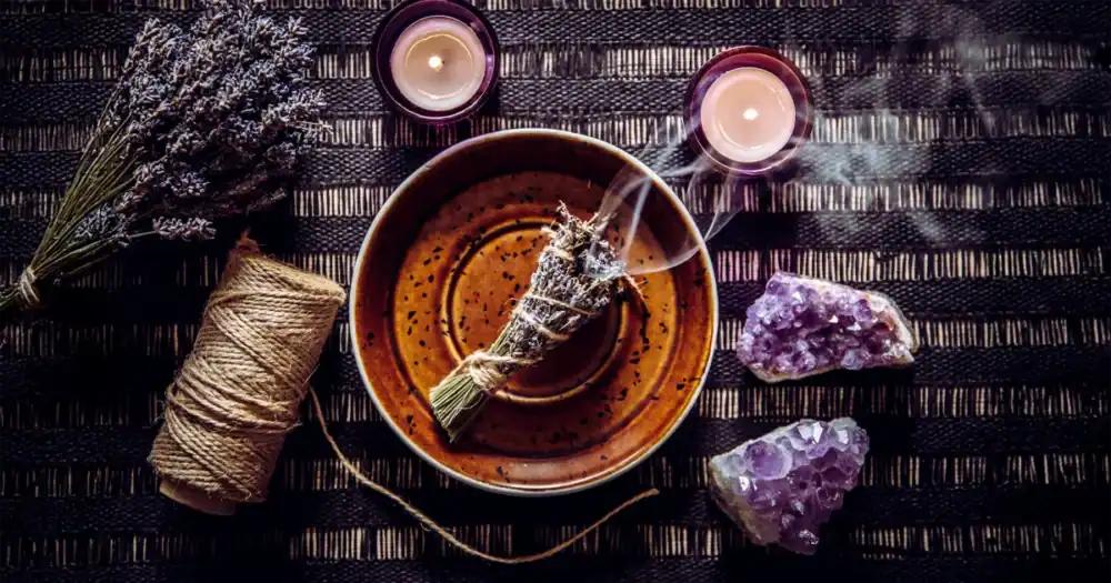 image for Symbolism of Beginnings that showcases quartz, yellow plants or flowers and small herbs growing in a pot.