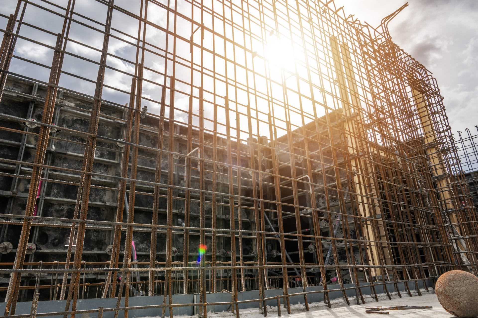 A modern residential building under construction, possibly related to ADUs garage conversions Florida, with scaffolding and w