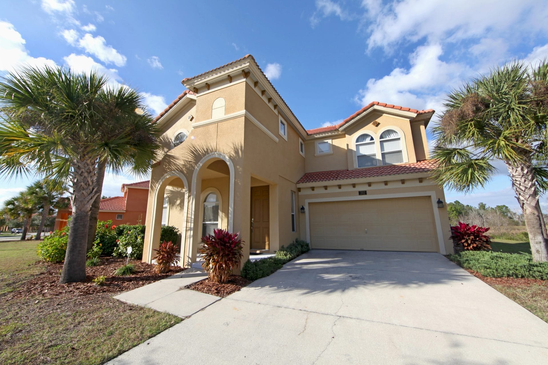 Modern custom home construction Florida featuring a spacious living area with large windows and a minimalist interior design.