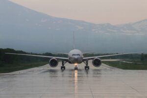 airplane on wet runway taxiing