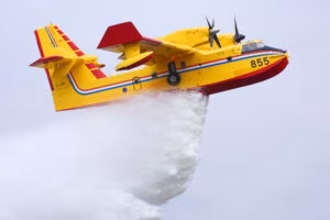 picture of plane dropping water on fire