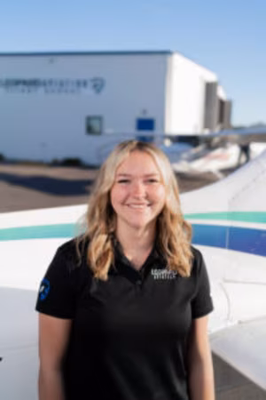 Image of aspiring pilot in front of the Cessna with modern avionics.