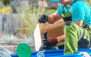 man-fixing-sprinkler-m2 man fixing sprinkler