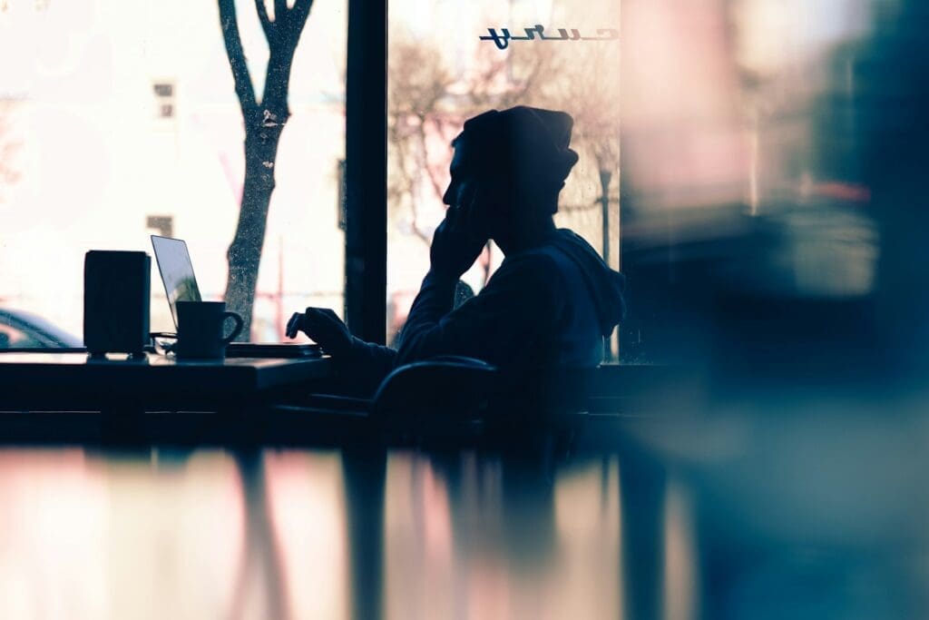 Discover The 5 Effective Ways To Reduce Oxidative Stress And Boost Your Health 3 silhouette of a person sitting in front of a laptop
