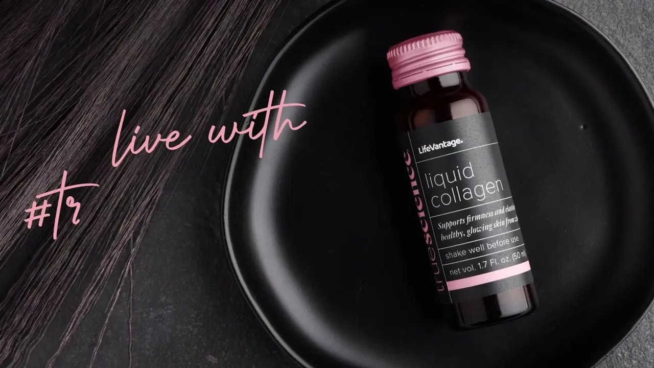 Activate Skin Collagen With Truescience Liquid Collagen 5 LifeVantage TrueScience Liquid Collagen bottle on a black plate with hair strands beside it, product shot showing label and pink cap.