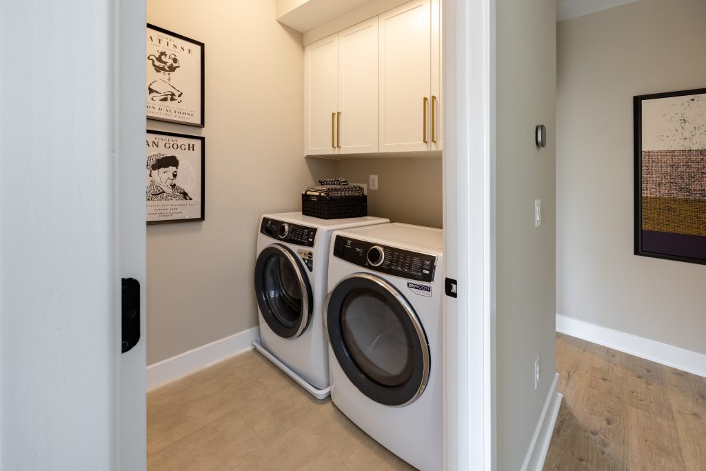 Image of a laundry room with storage.