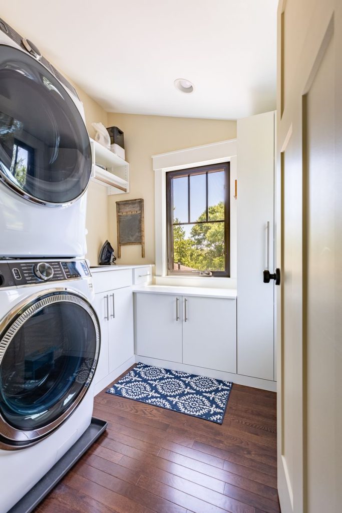Laundry room with storage closets