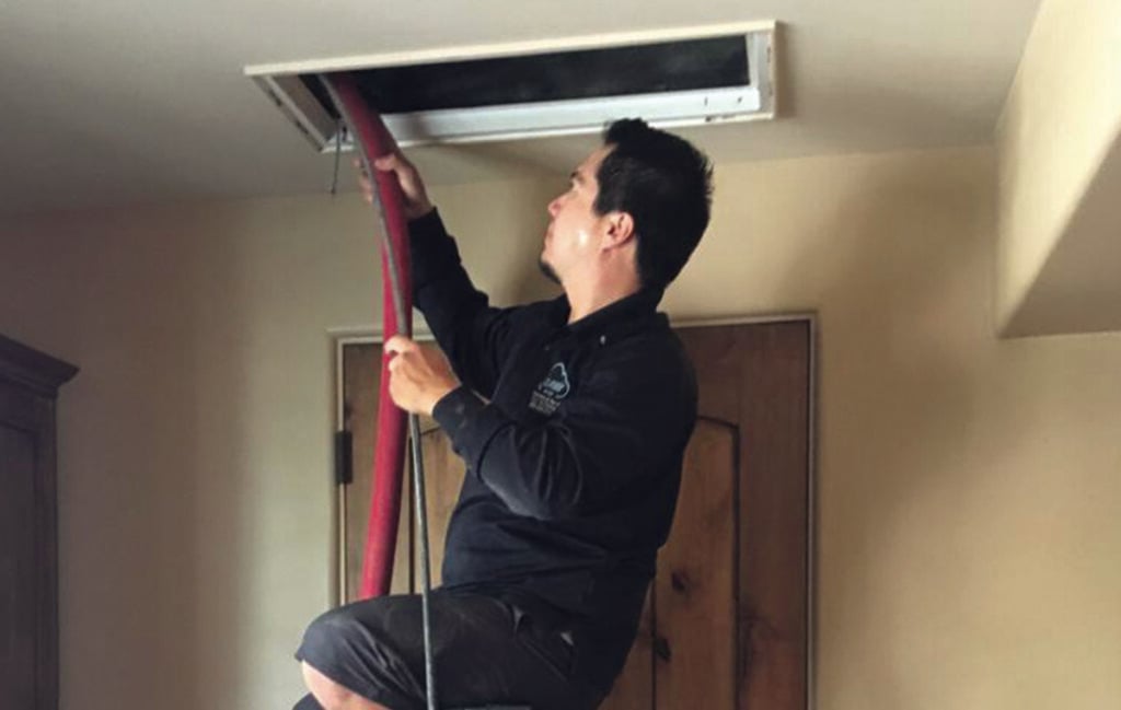 air duct cleaning technician in mesa, az cleaning air duct vent at a customer's house in mesa, arizona air duct cleaning technician in mesa, az cleaning air duct vent at a customer's house in mesa, arizona
