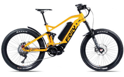 Voyager Ultra EX Bright yellow full-suspension electric mountain bike with thick tires and black battery.