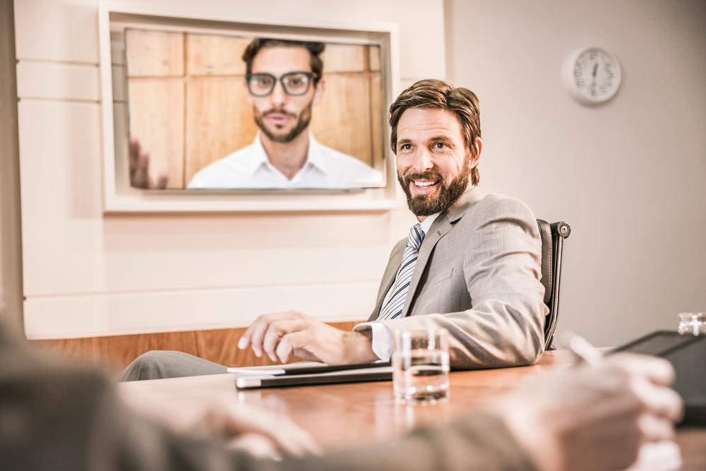 Business,People,In,Boardroom,Having,Video,Call,Meeting