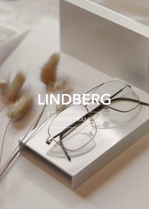lindberg-final1_3 Lindberg minimalist eyewear on white box, styled with fluffy dried grass. Elegant design.