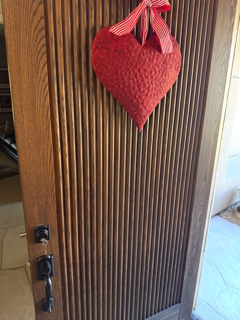 How a Locksmith Can Walk Through Your Home and Tell You What's Weak A locksmith performing a home security lock audit on a residential front door deadbolt in a sunny Arizona neighborhood