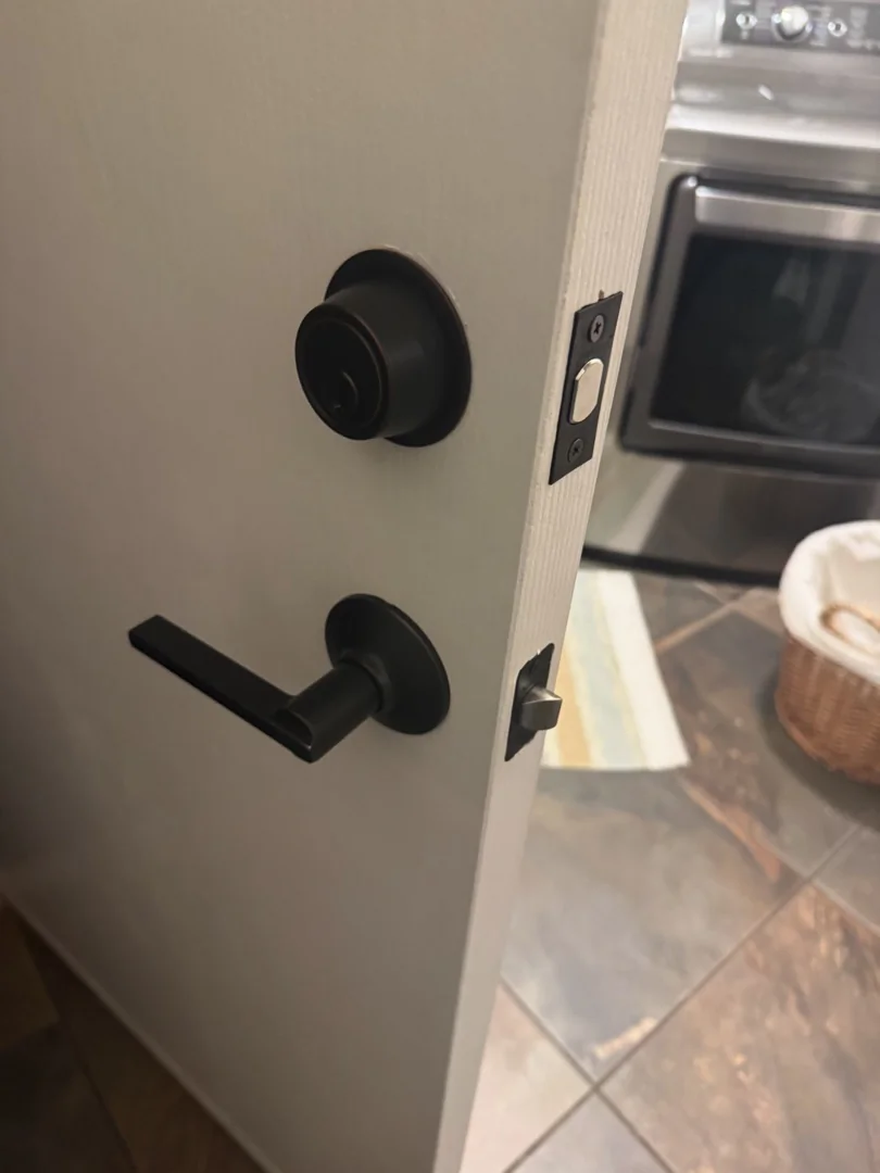 Window Lock Installation: A Small Upgrade with a Big Security Impact A locksmith performing window lock installation on a double-hung window inside a bright Arizona home, demonstrating professional home window security locks.