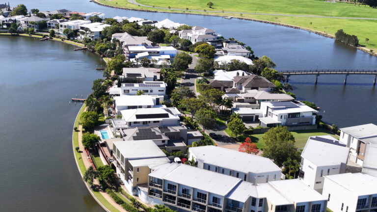 Aerial view of a modern Australian waterfront residential neighbourhood