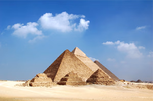 Great Pyramids of Giza under a clear blue sky, a highlight of Egypt tour packages and Giza pyramids tours.
