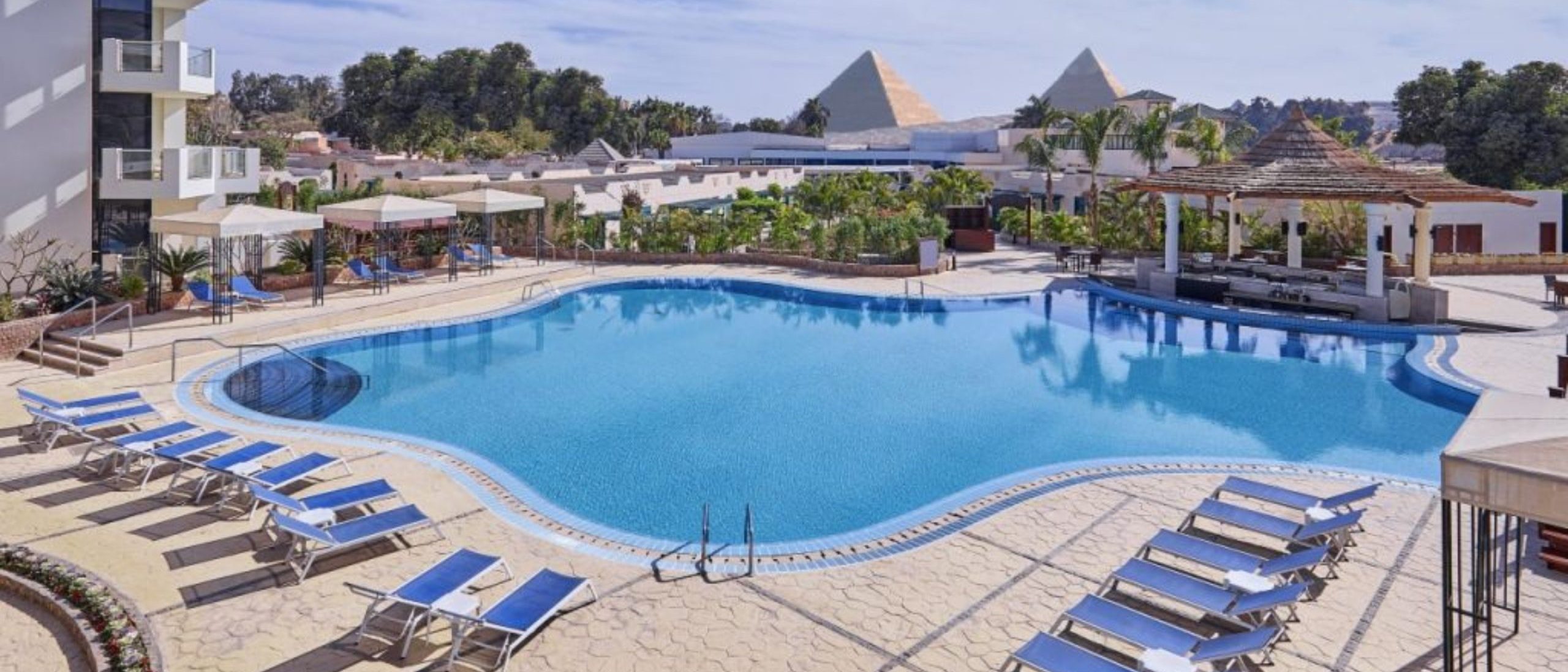 Great Pyramids of Giza visible in the background.