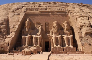 The grand entrance to Abu Simbel, showcasing its massive statues and ancient Egyptian architecture.