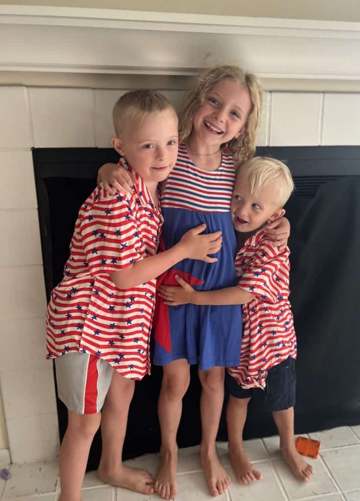 Friendly children hugging and smiling, showcasing family happiness and health care.