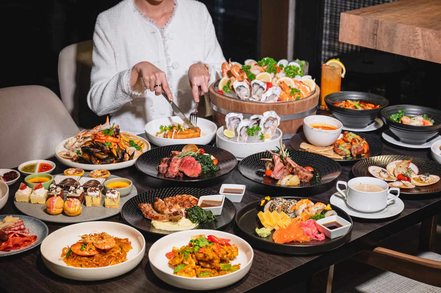 Diners enjoying the Sea+Land hotel buffet Bangkok 2026 spread at Stock.Room, Kimpton Maa-Lai Bangkok