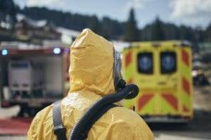 News 33 Biohazard cleanup marketing strategies team member in protective gear at a crime scene, emphasizing emergency services.