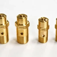 Top-down flat lay of brass safety valves 1/4" and 3/8" NPT with 150, 170, and 200 PSI ratings for automotive air dryers