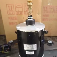Fan Motor YS700A SW700A YTP700-6A for Gree Air Conditioner shown next to a common object for size comparison
