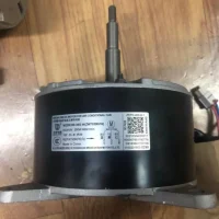 Air conditioner DC motor WZDK200-38G-W installed in fan application, showing 200W 310V brushless motor unit